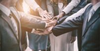 Business People In Huddle