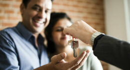 Couple receiving keys to their home